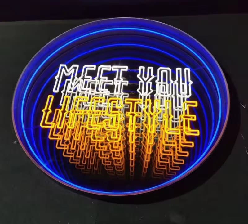 Printed infinity mirror sign in a branded retail setting